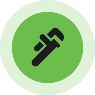Green wrench icon on circular background